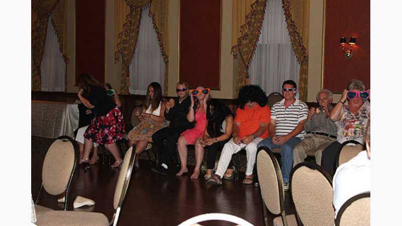 Stage Hypnosis Show 2 Hypnotist Toronto, Hypnotised volunteers wearing very funny looking large glasses. Taken in Toronto Ontario